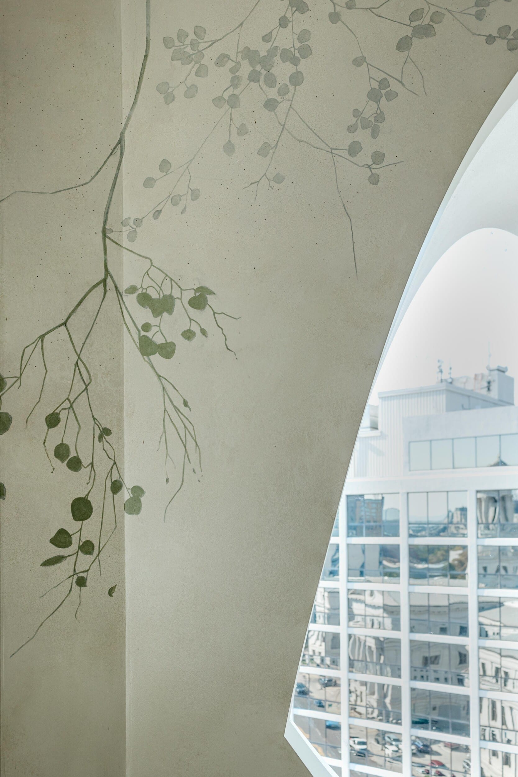 Wall at Populus Hotel with aspen branch mural painting.